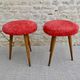 Pair of tripod stools, with tapered wooden feet and moumoute seat