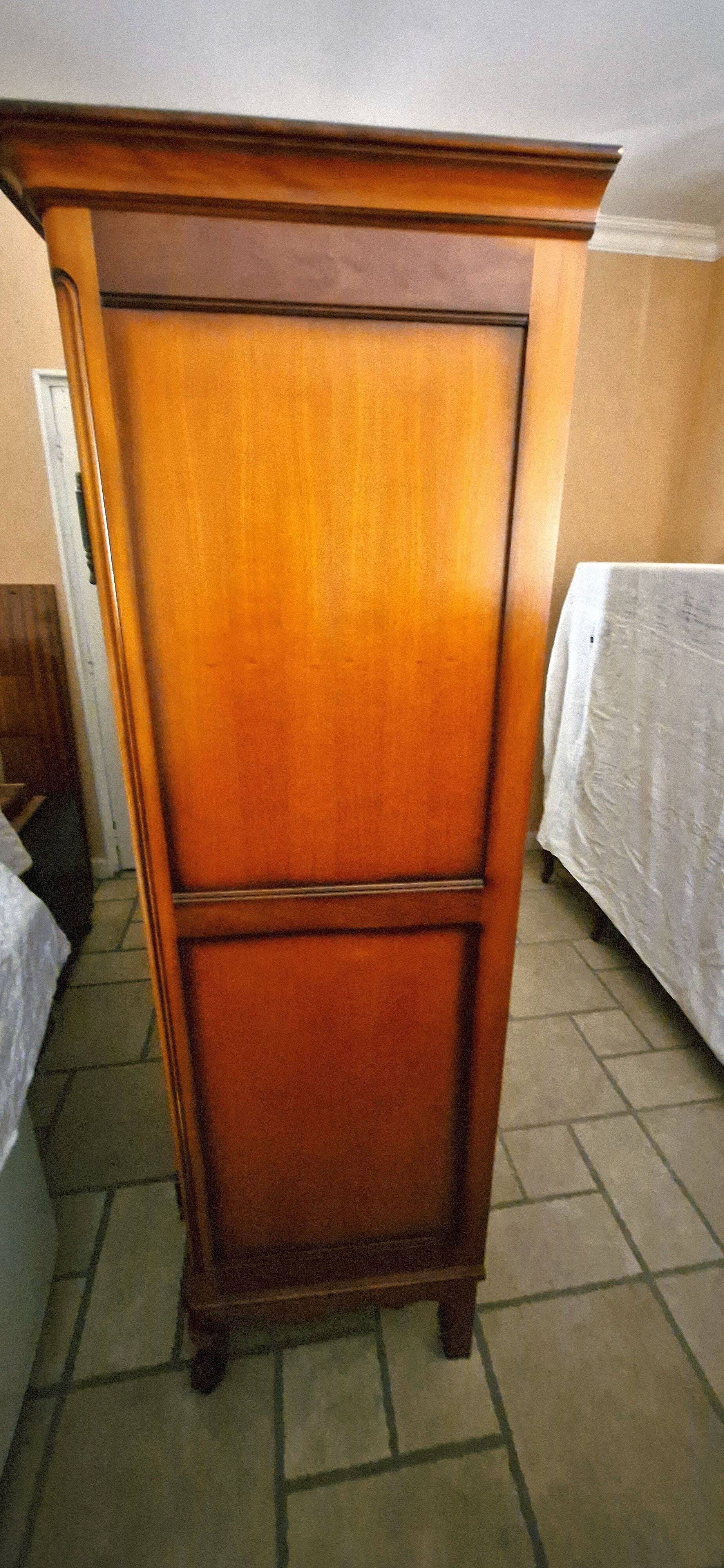 Wooden style wardrobe, 3 doors and 9 internal shelves.