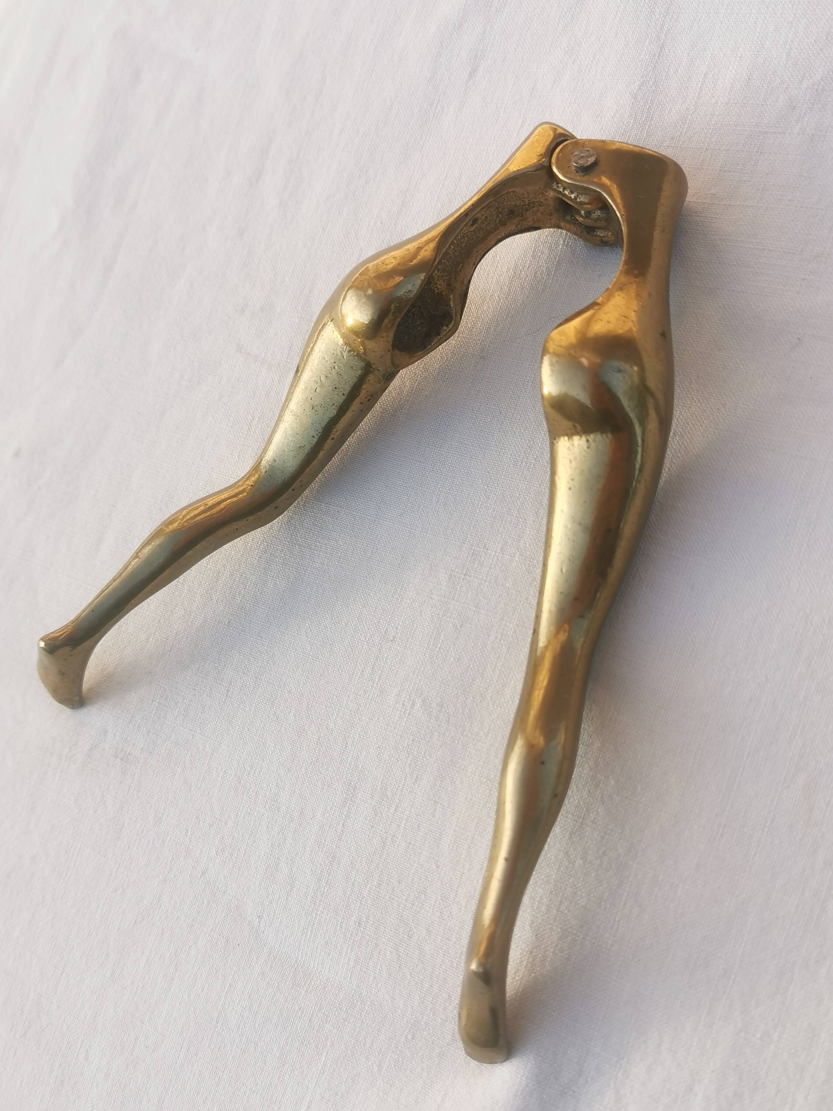 “woman’s legs” nut cracker in bronze