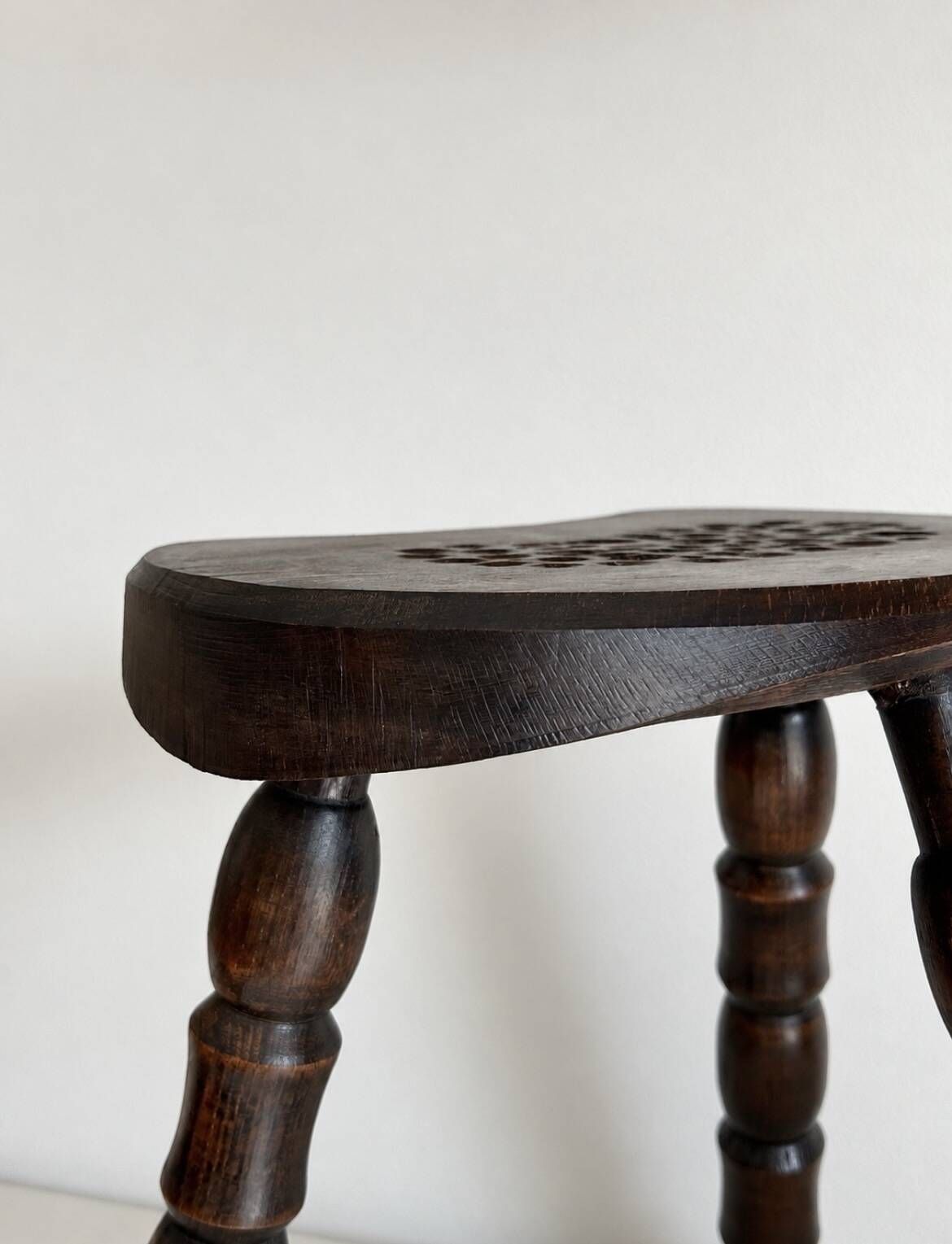 Restored dark wood tripod stool, bobbin leg, elegant furniture.