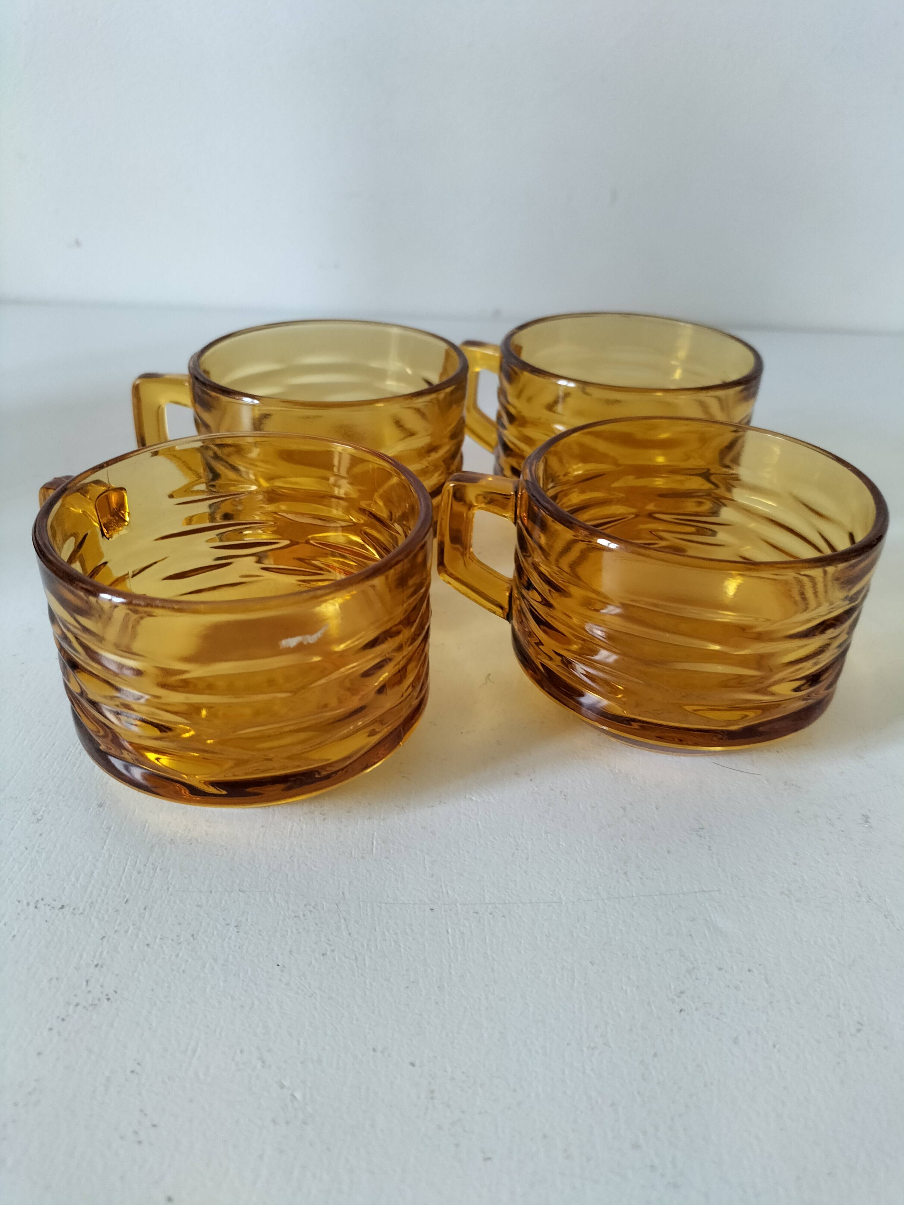 Set of 4 vintage amber glass mugs with textured 70s design