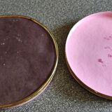 Old round box with decoration fixed under glass