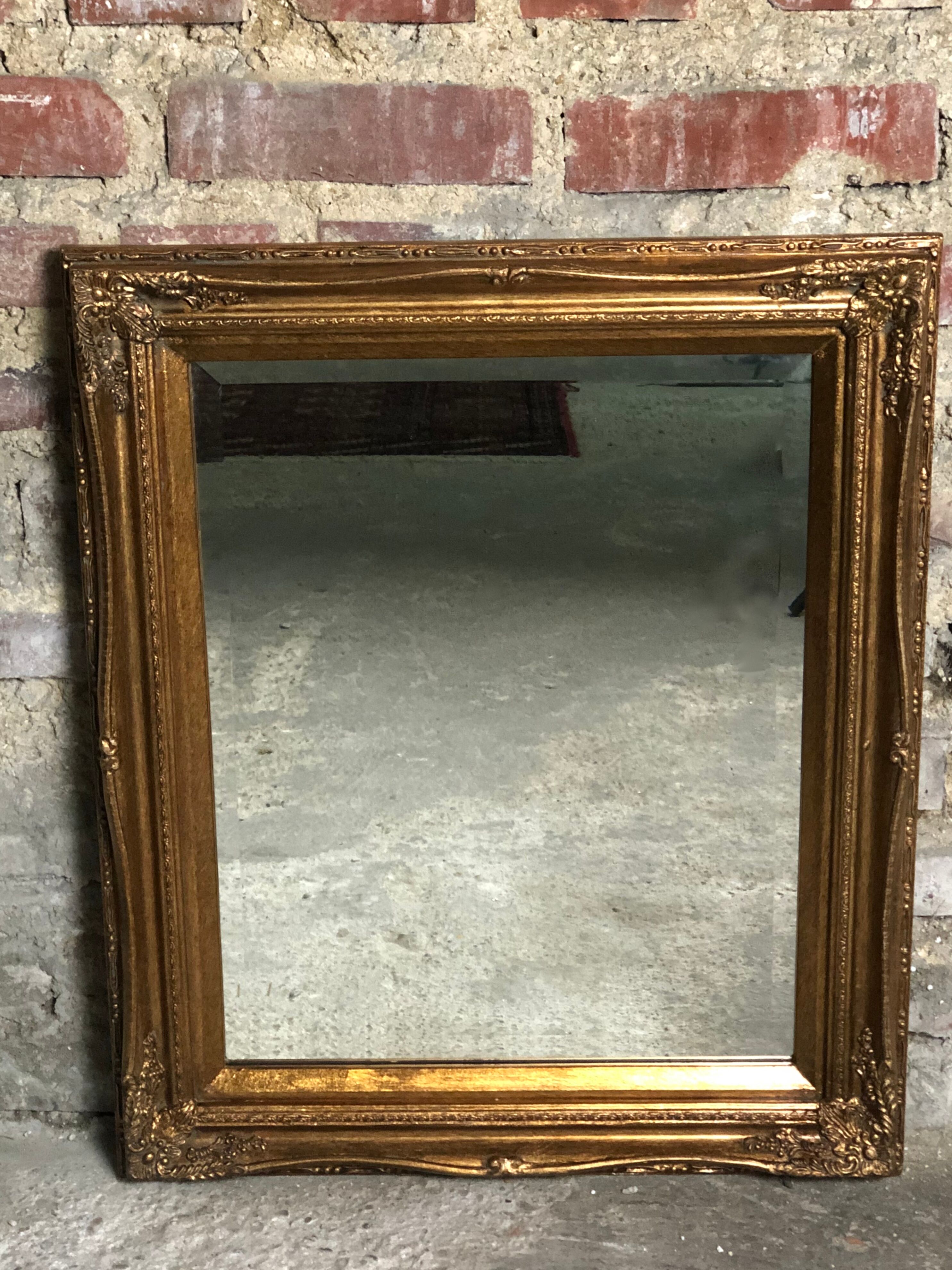 Oval mirror style Louis XV patinated gold 63 x 53 cm