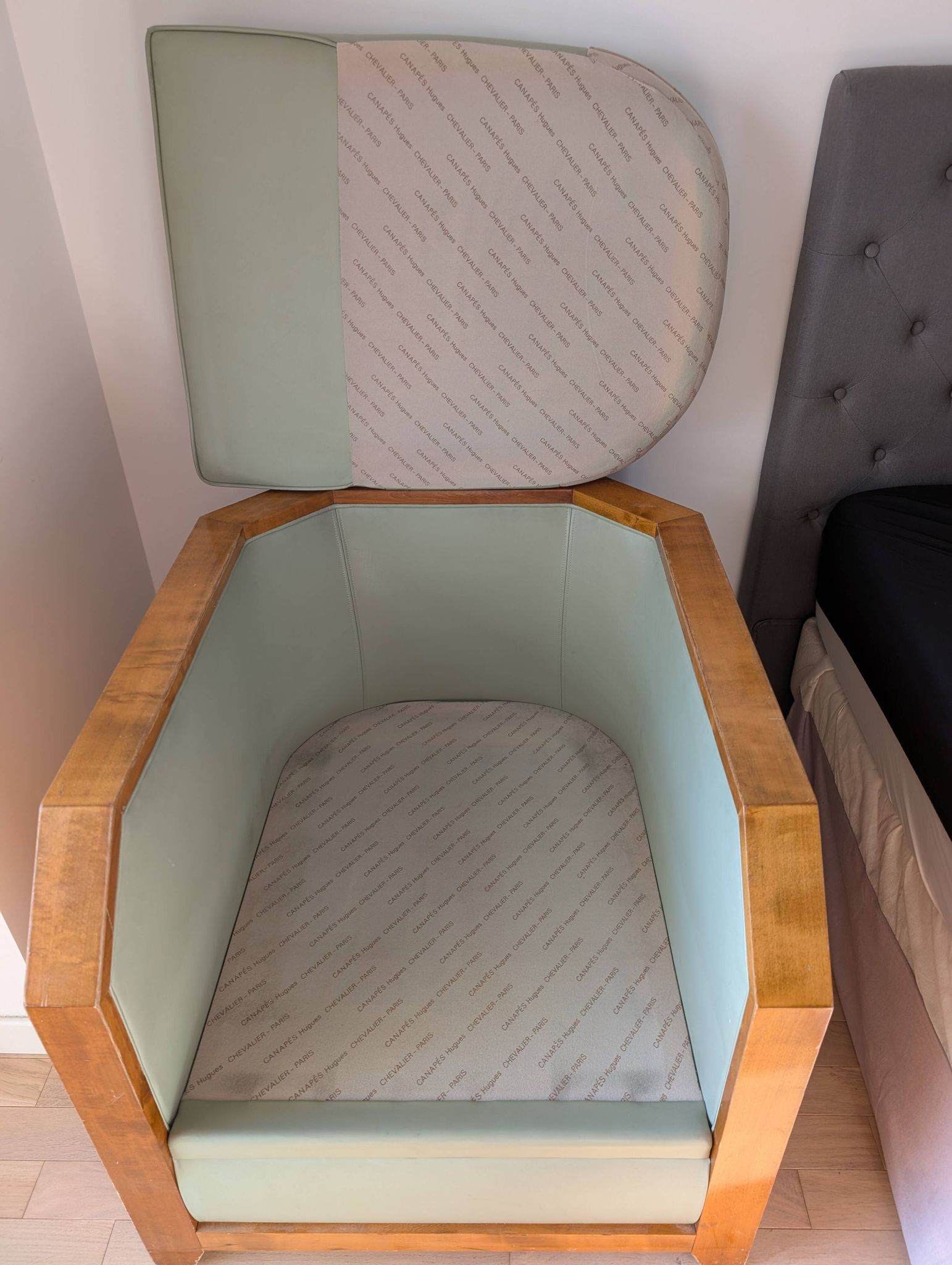 Vintage armchair Hugues Chevalier Paris — Almond green leather & Wood