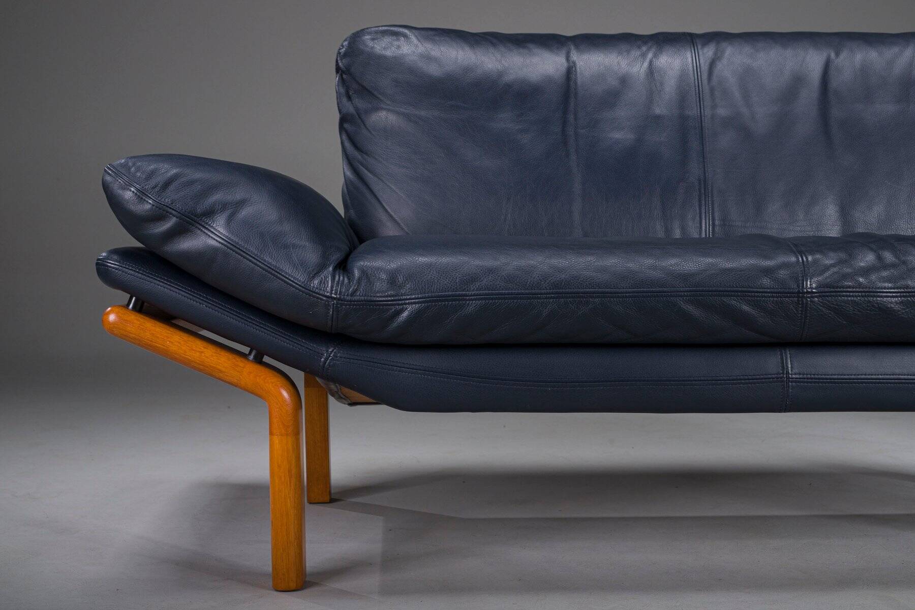 Danish teak and navy blue leather 2-seater sofa from Komfort, 1970s