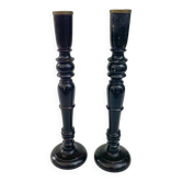 Pair of antique ebonised wooden candlesticks from the 19th century.