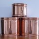 three cylindrical plant pots in a Scandinavian design from the 80s