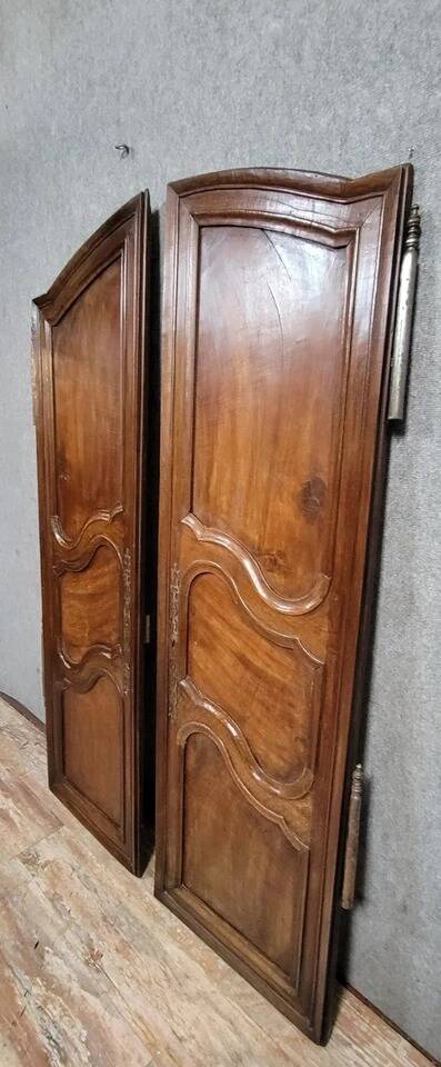 Pair of Louis XV period molded doors in solid walnut