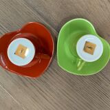 Two cups and saucers in porcelaine Yves Saint Laurent