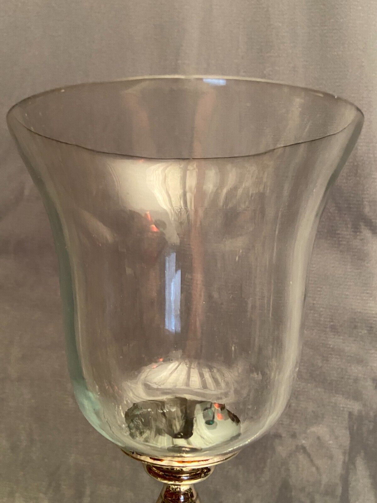 Glass photophore on high metal foot with silver patina