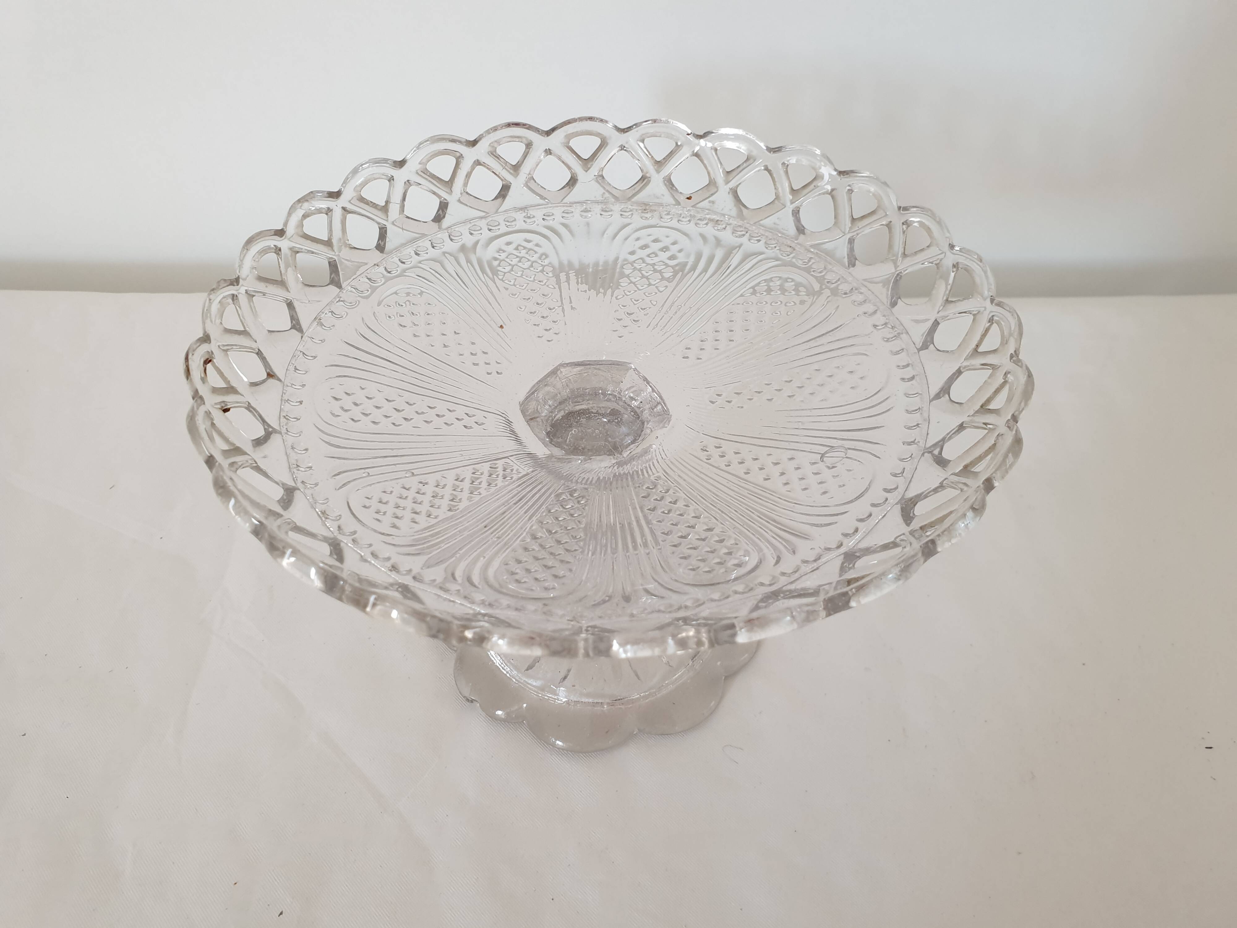 Old cup in molded glass colorless decorative table mignardises