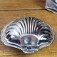 Shell-shaped butter dish in stainless steel and blue glass