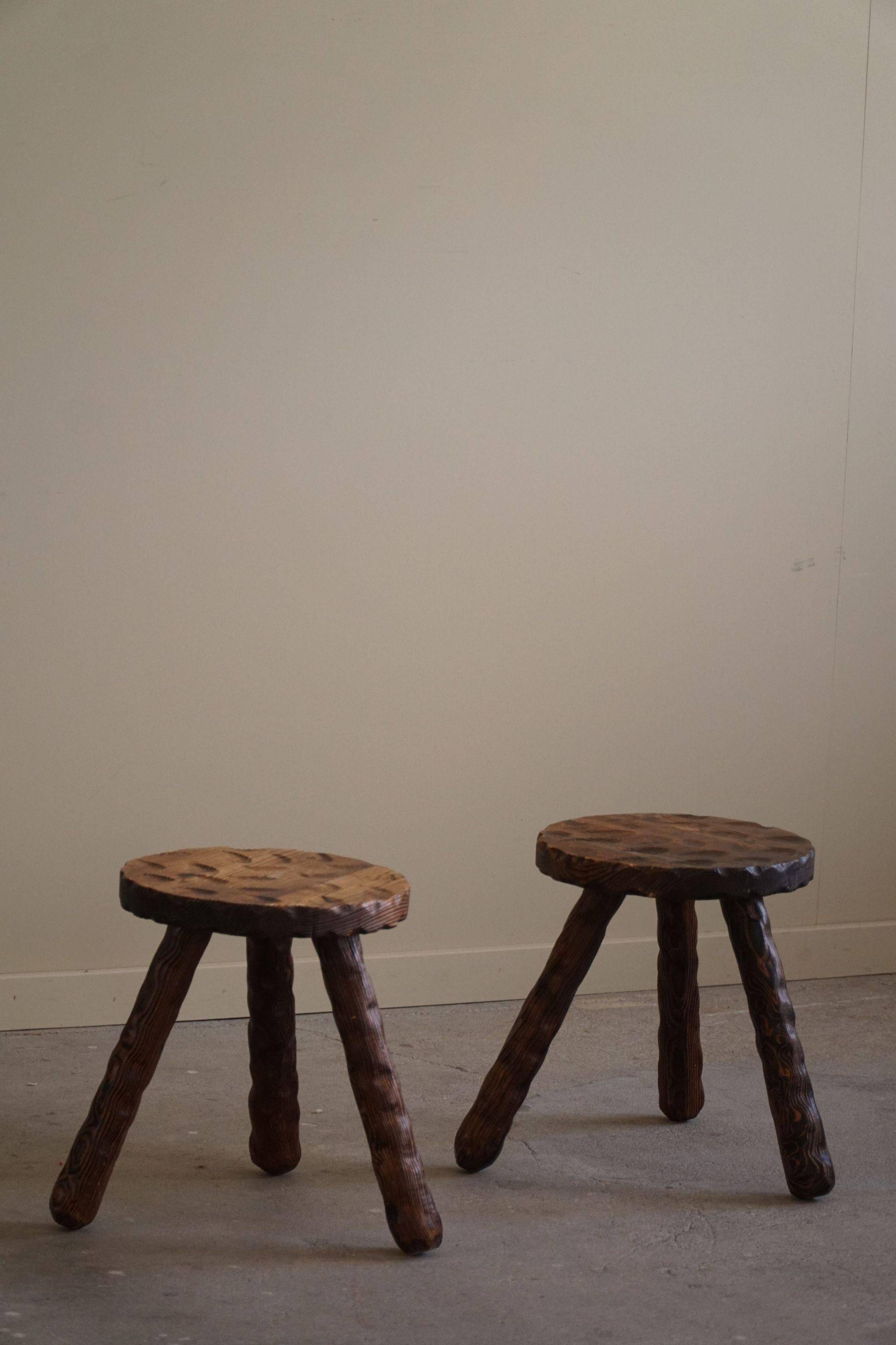 A pair of Wabi Sabi stools carved from pine, mid-century modern Swedish style, 1960s.