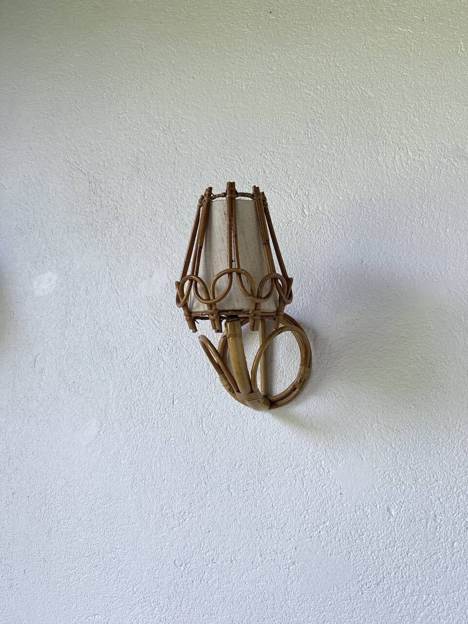 Pair of rattan wall lights by Louis Sognot, 1960.