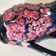 Vintage pitcher in midnight blue glazed ceramic with bright pink relief