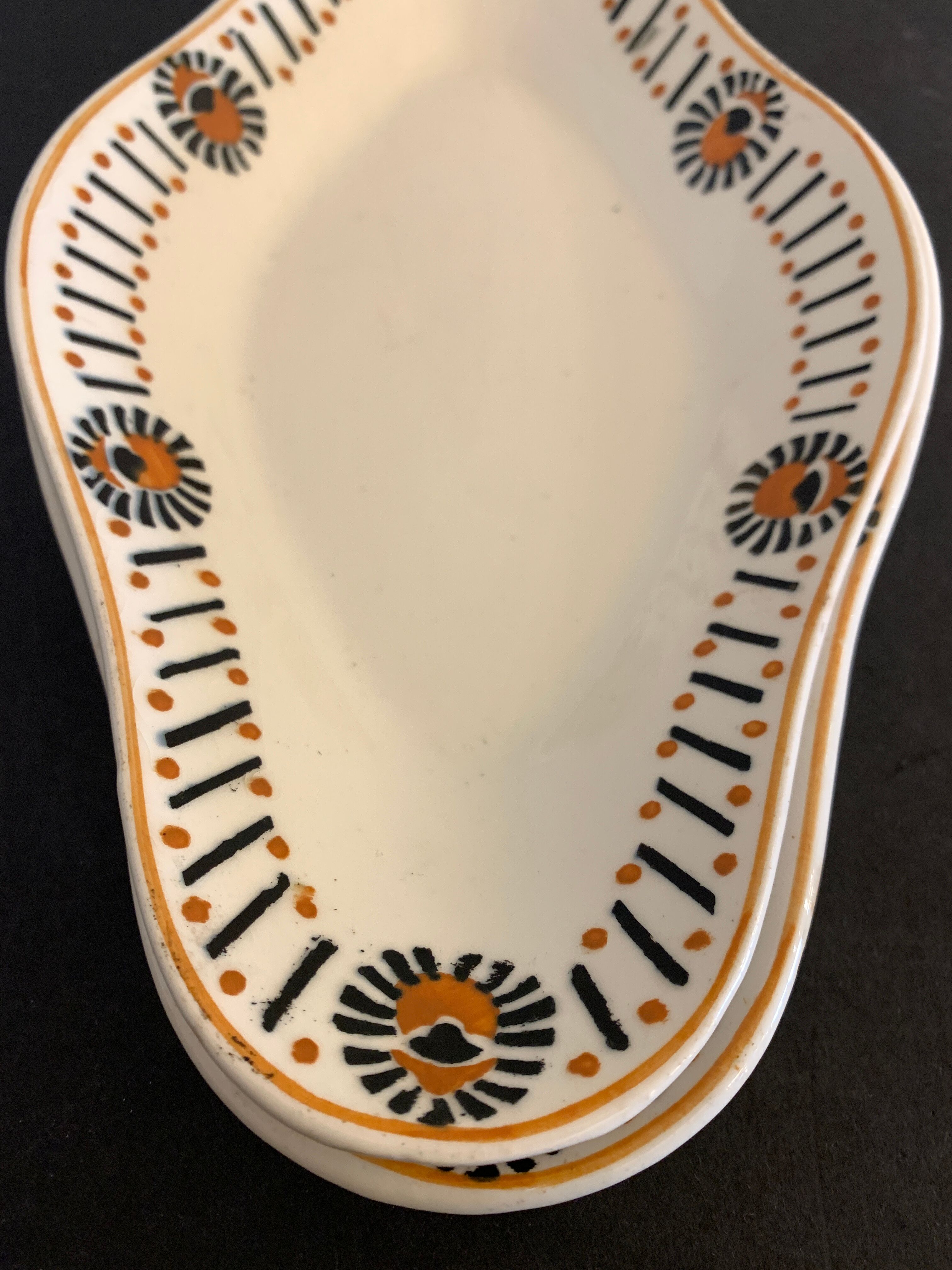 Pair of art deco raviers signed Longwy and numbered, model Gerazine