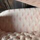 Small vintage 2-seater sofa from the 70s in Hollywood Regency style, satin pink.