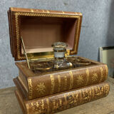 Liquor cellar in false pretence of stacked bound books
