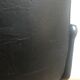 Fauteuil de bureau roulettes et skaï noir vers 1970