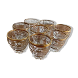 Suite de 8 verres à liqueur en verre blanc et réhauts d'or, circa 1970