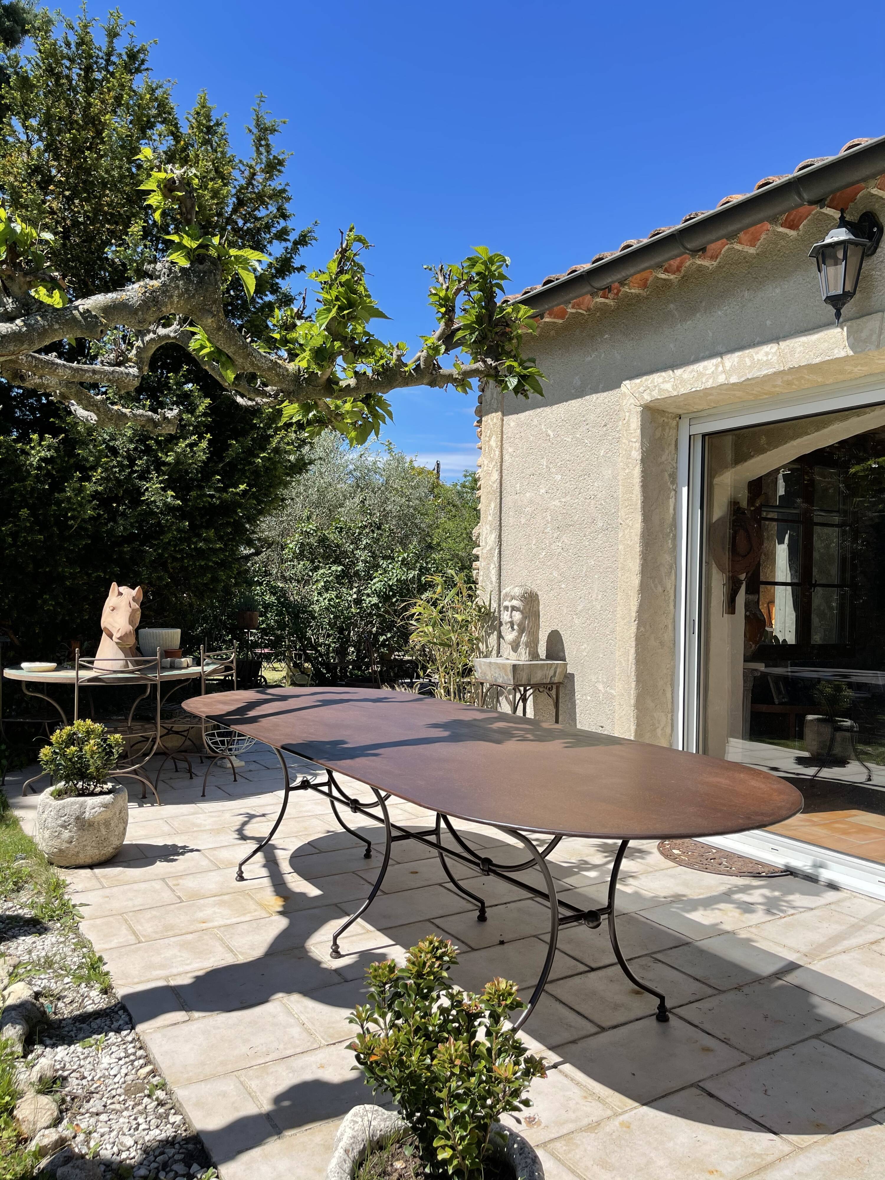 Artisanal wrought iron garden table