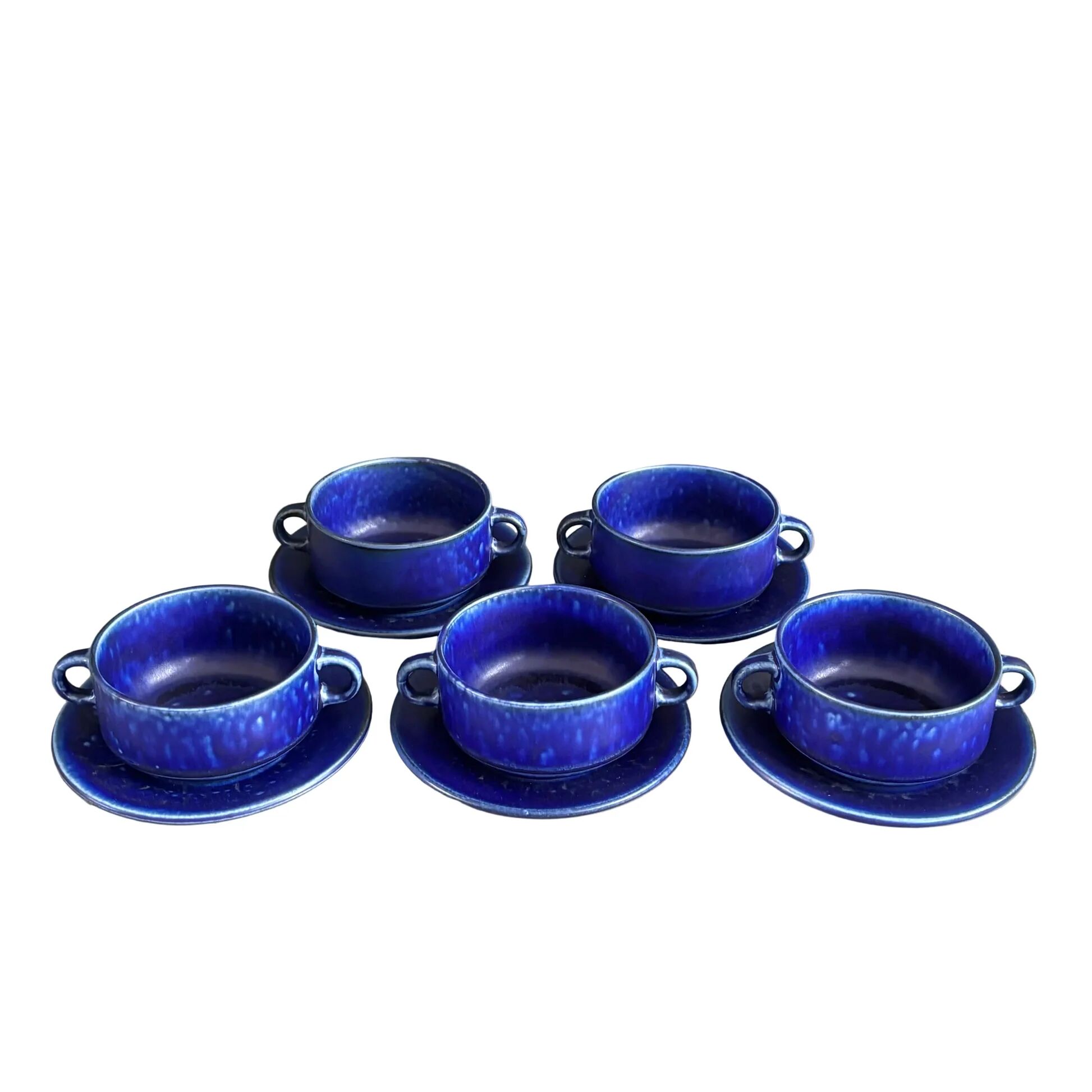 Set of 5 blue Klein ceramic tea cups with saucers.
