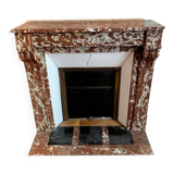 Red marble fireplace with modillion