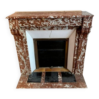 Red marble fireplace with modillion