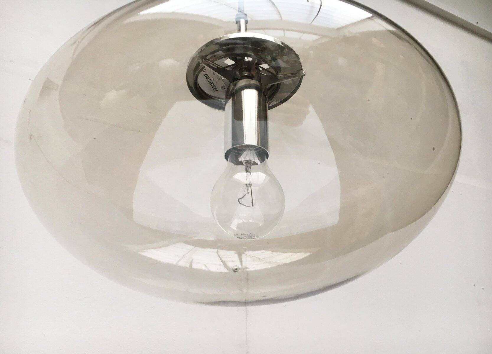 Suspended UFO-shaped glass luminaires in mid-century German Space Age style, set of 3.