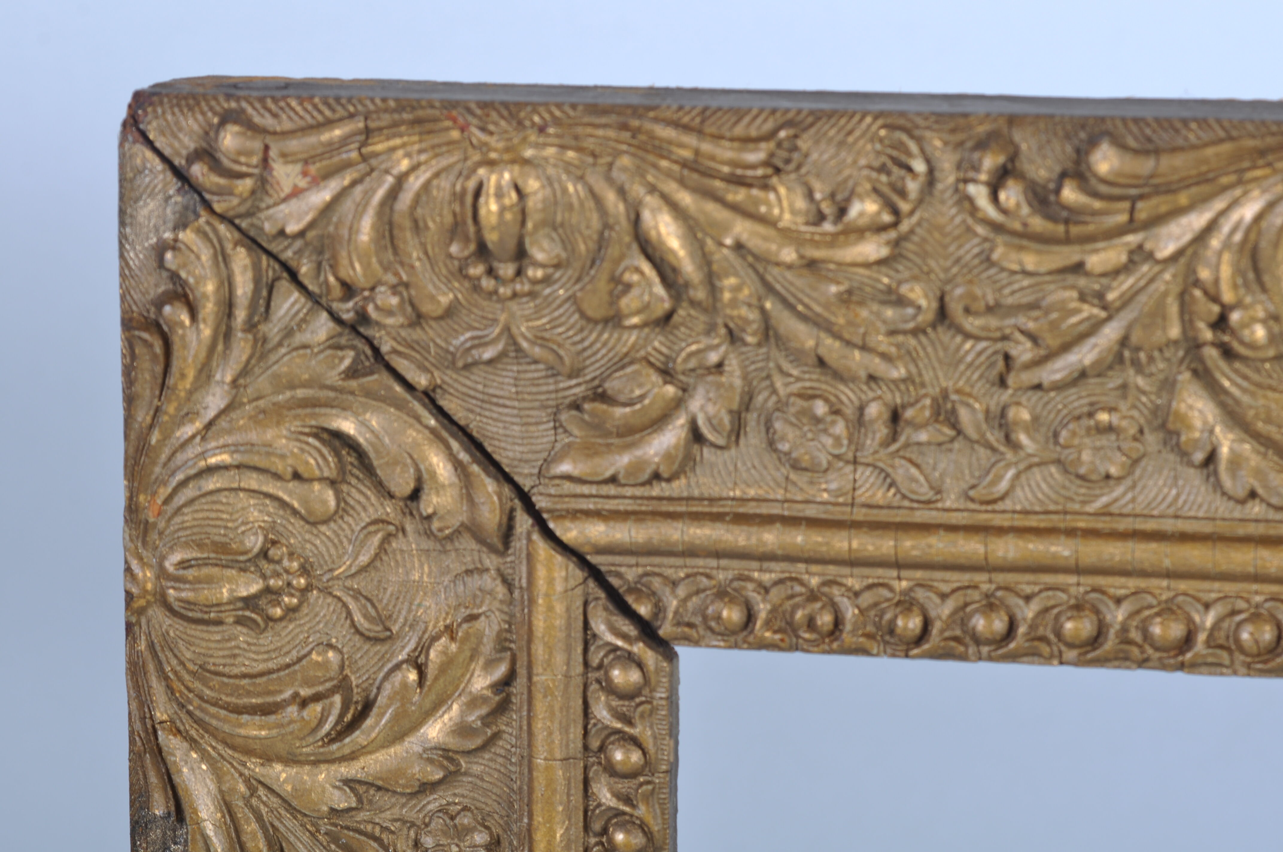 Old wooden frame, gilded stucco
