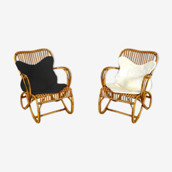 Paire de fauteuils vintage en rotin avec peaux