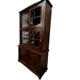 Vintage wooden display cabinet with sliding doors.