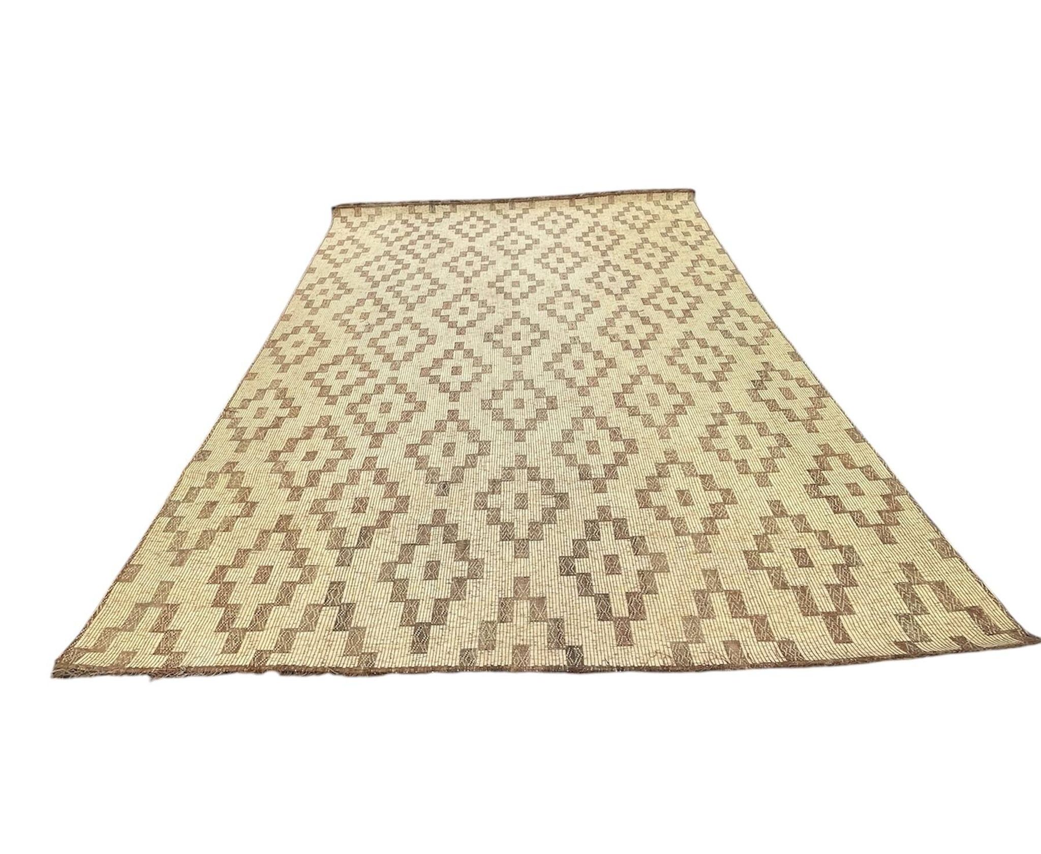 Vintage Touareg mat made of leather and reeds.