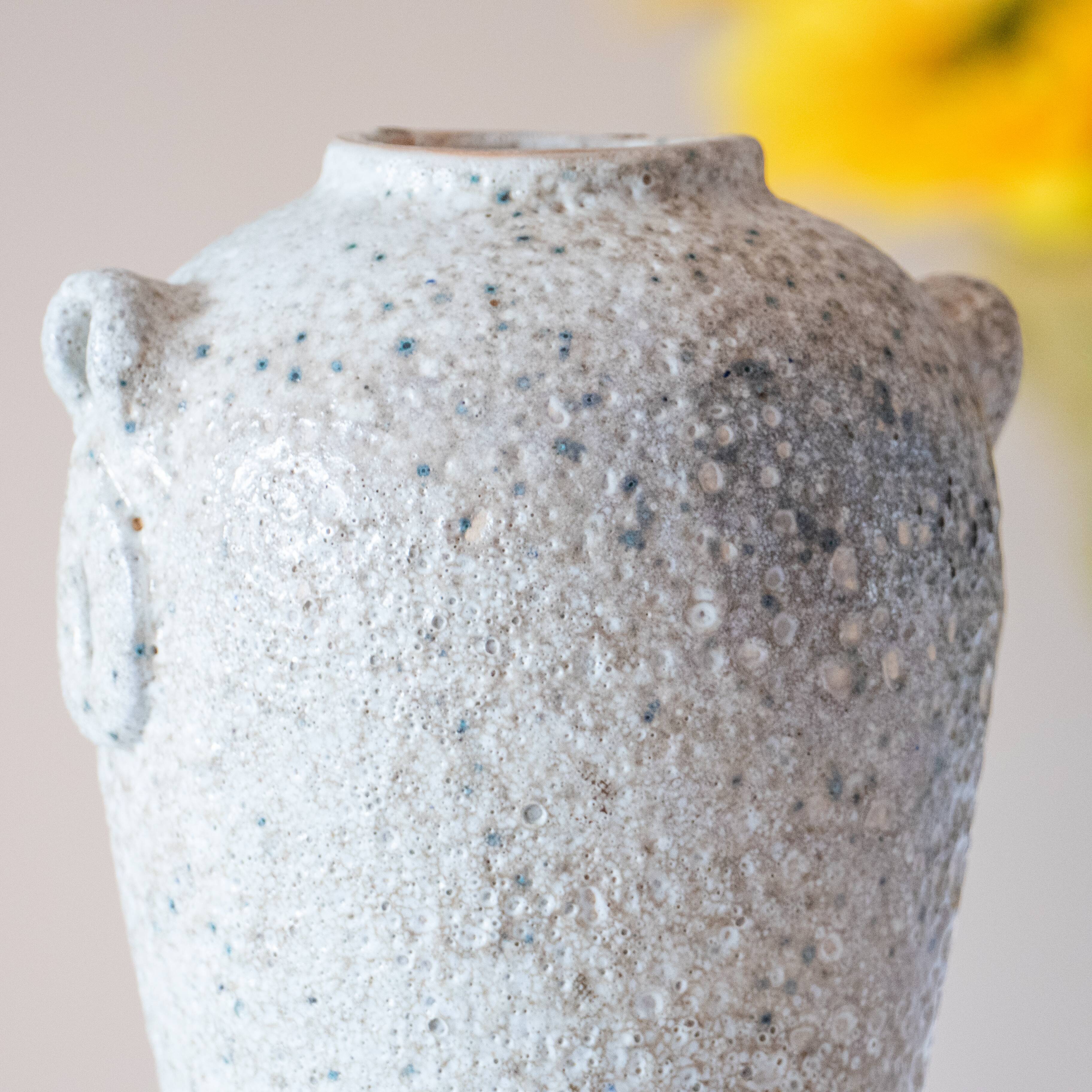 Old foam-glazed terracotta vase