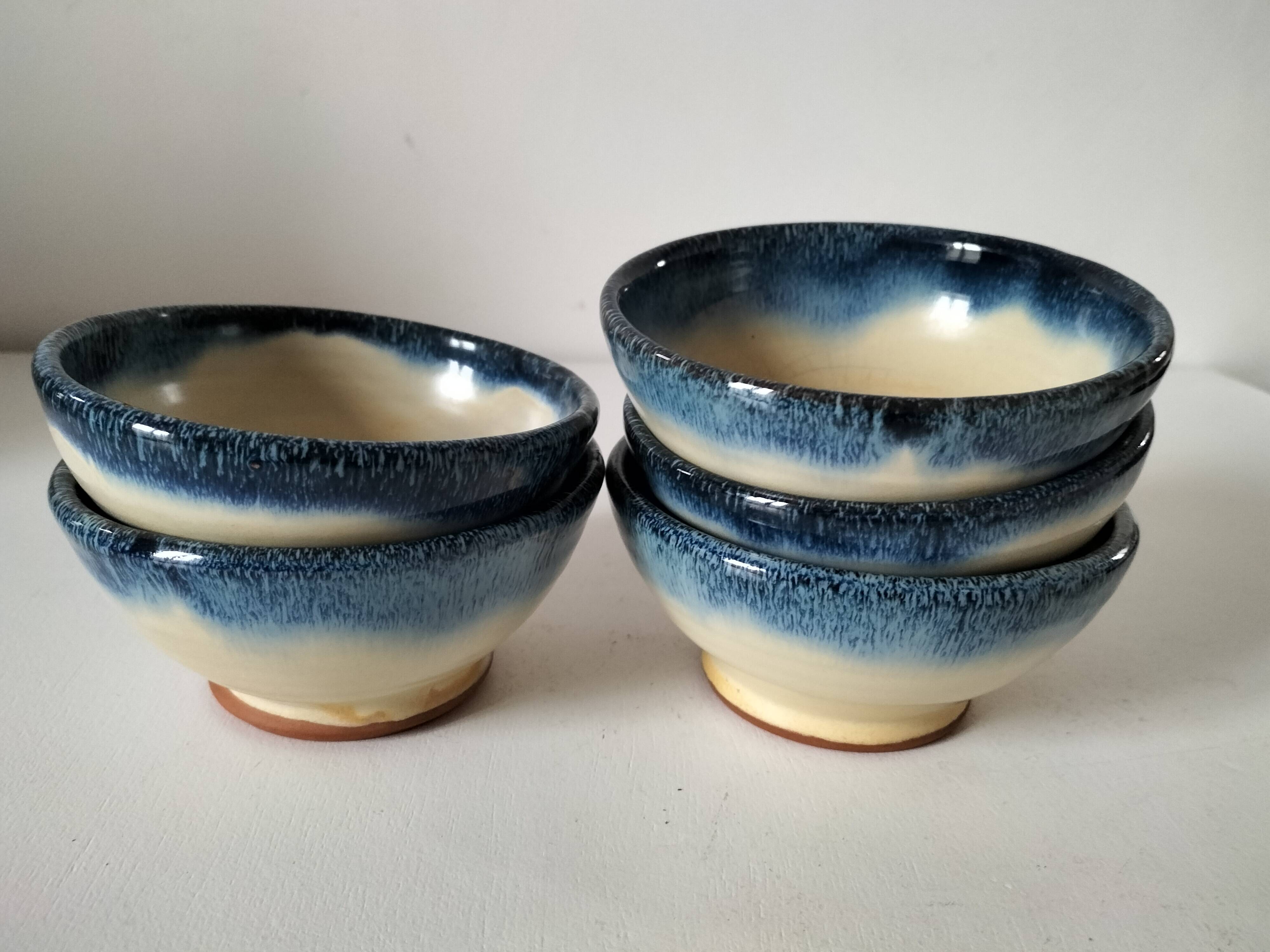 Set of 5 small blue and cream glazed stoneware bowls