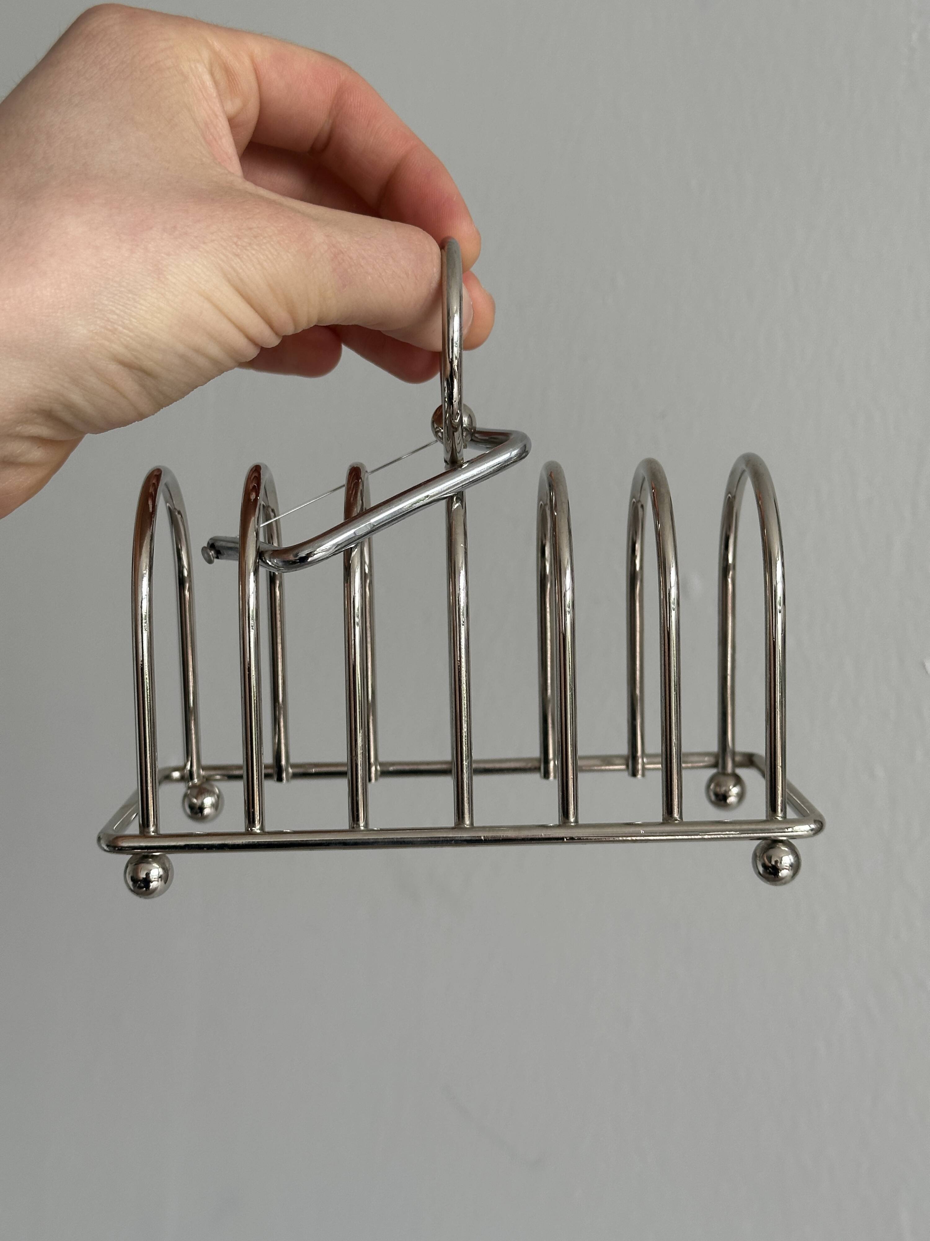 Porte-toast en métal argenté.