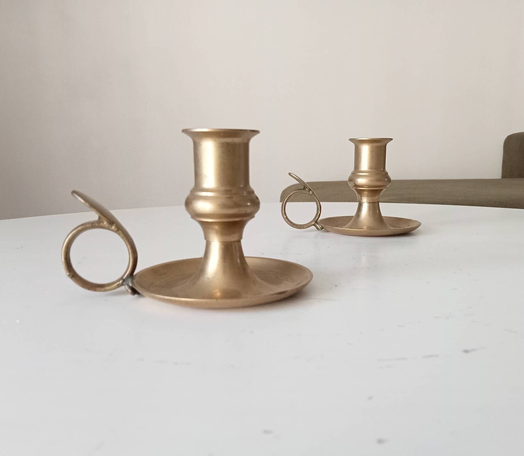 Antique hand candlestick in solid gilded brass.