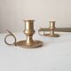 Antique hand candlestick in solid gilded brass.