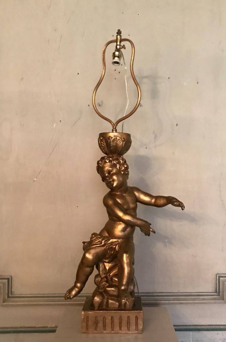 Deux enfants en bois sculpté doré, lampes de table