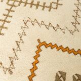 XXL Berber rug with long fringes from the 1960s. Cream-coloured pile with patterns in orange and green tones.