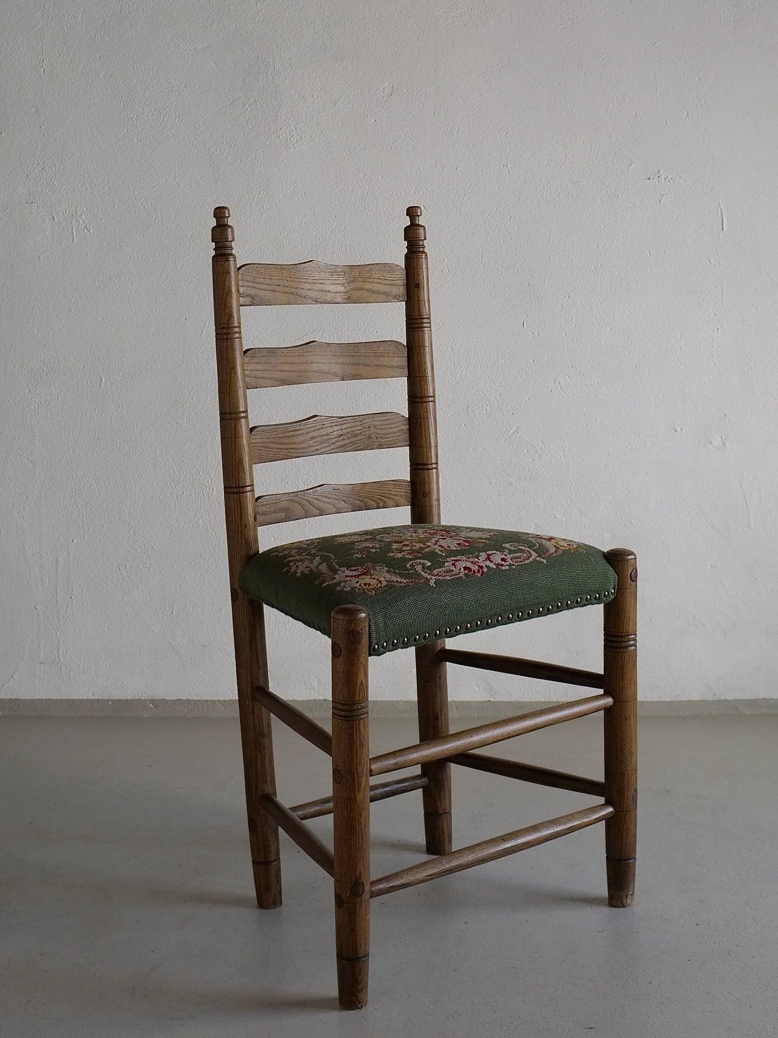 Rustic ladder-back oak chairs with embroidered seats | Netherlands | 1950s
