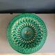 Large pierced earthenware fruit bowl glazed in green and gold.
