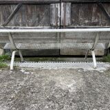 Old perforated metal garden bench