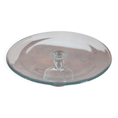 Large glass display plate mounted on a stand.