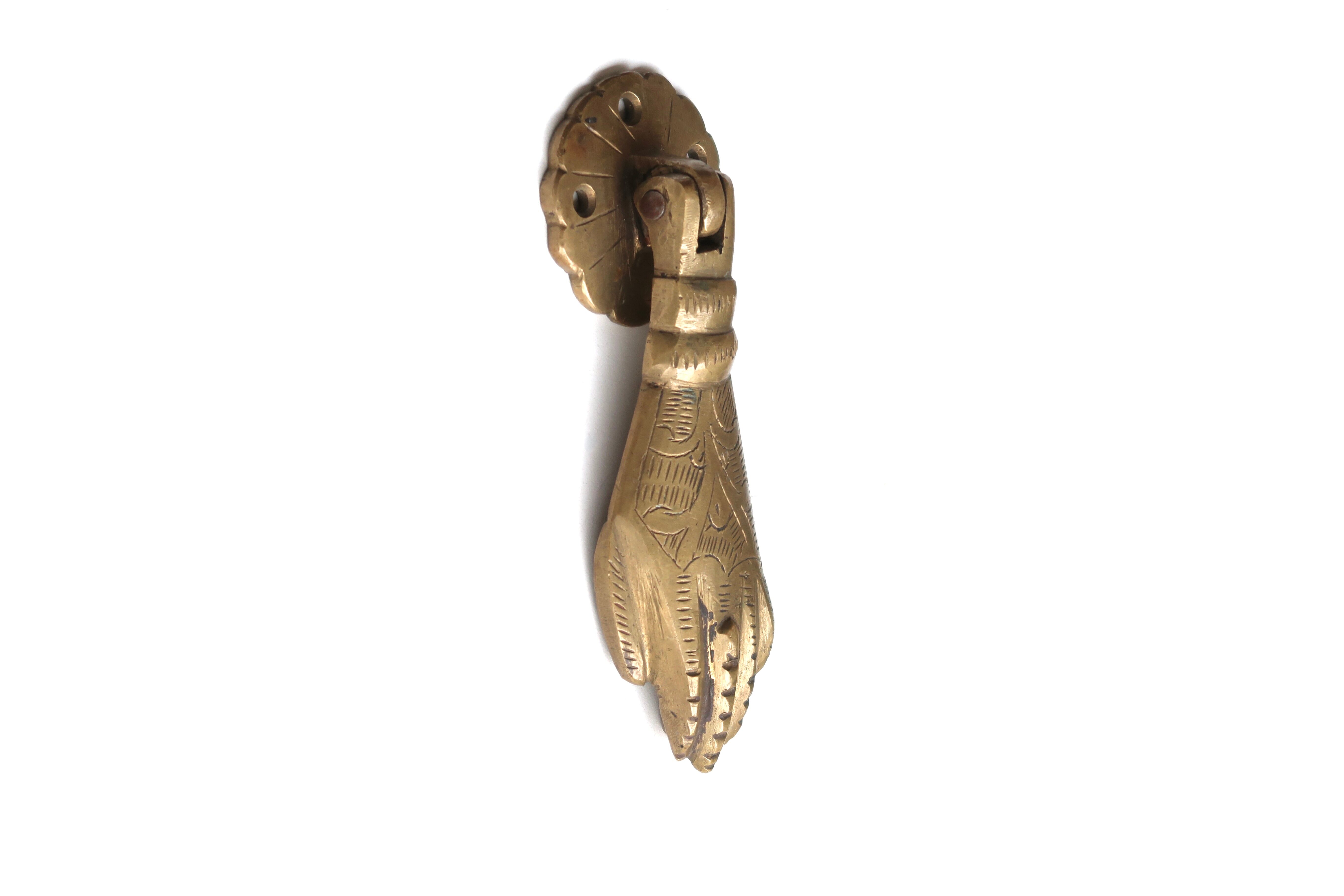 Hand-shaped brass door knocker, 70s