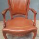 Louis XV style armchair covered in leather.