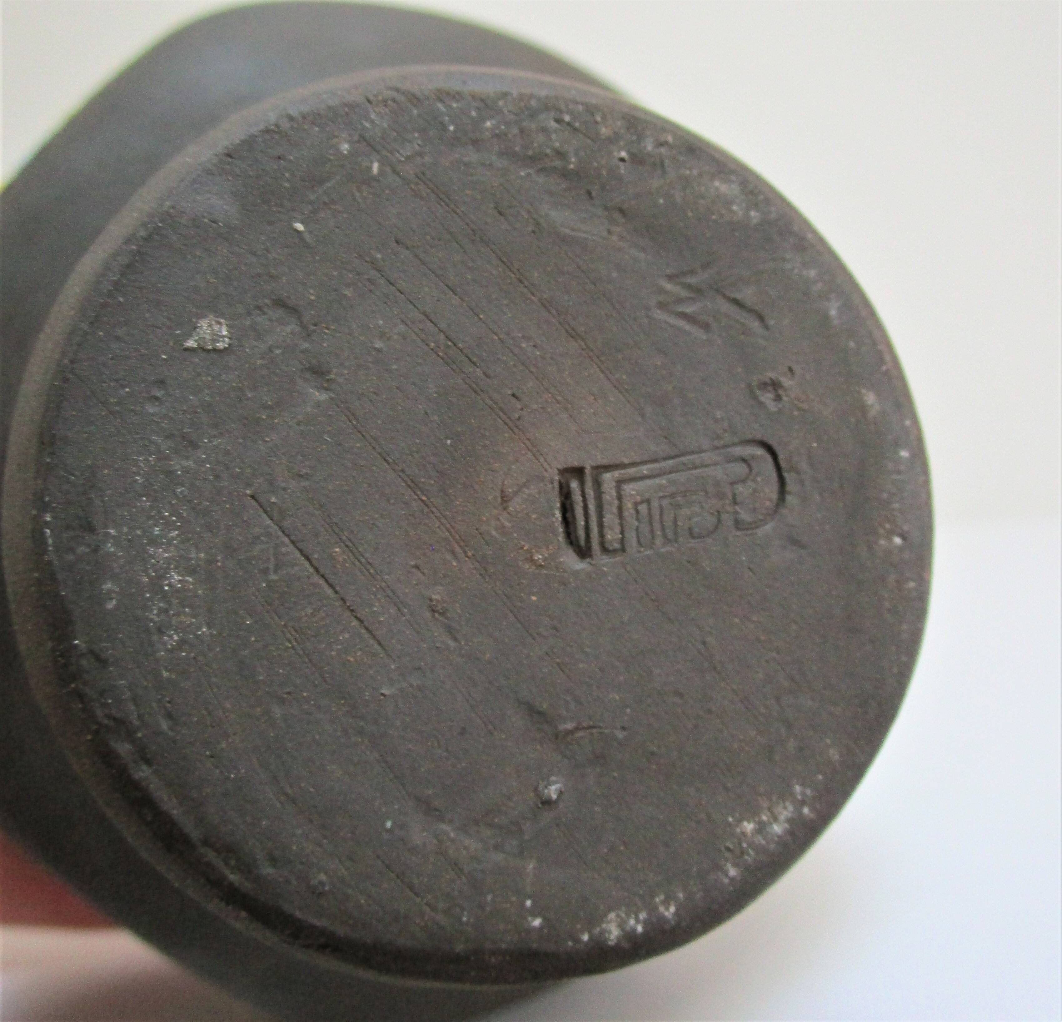 Anthropomorphic candle holder, scarified ceramic, stamped design