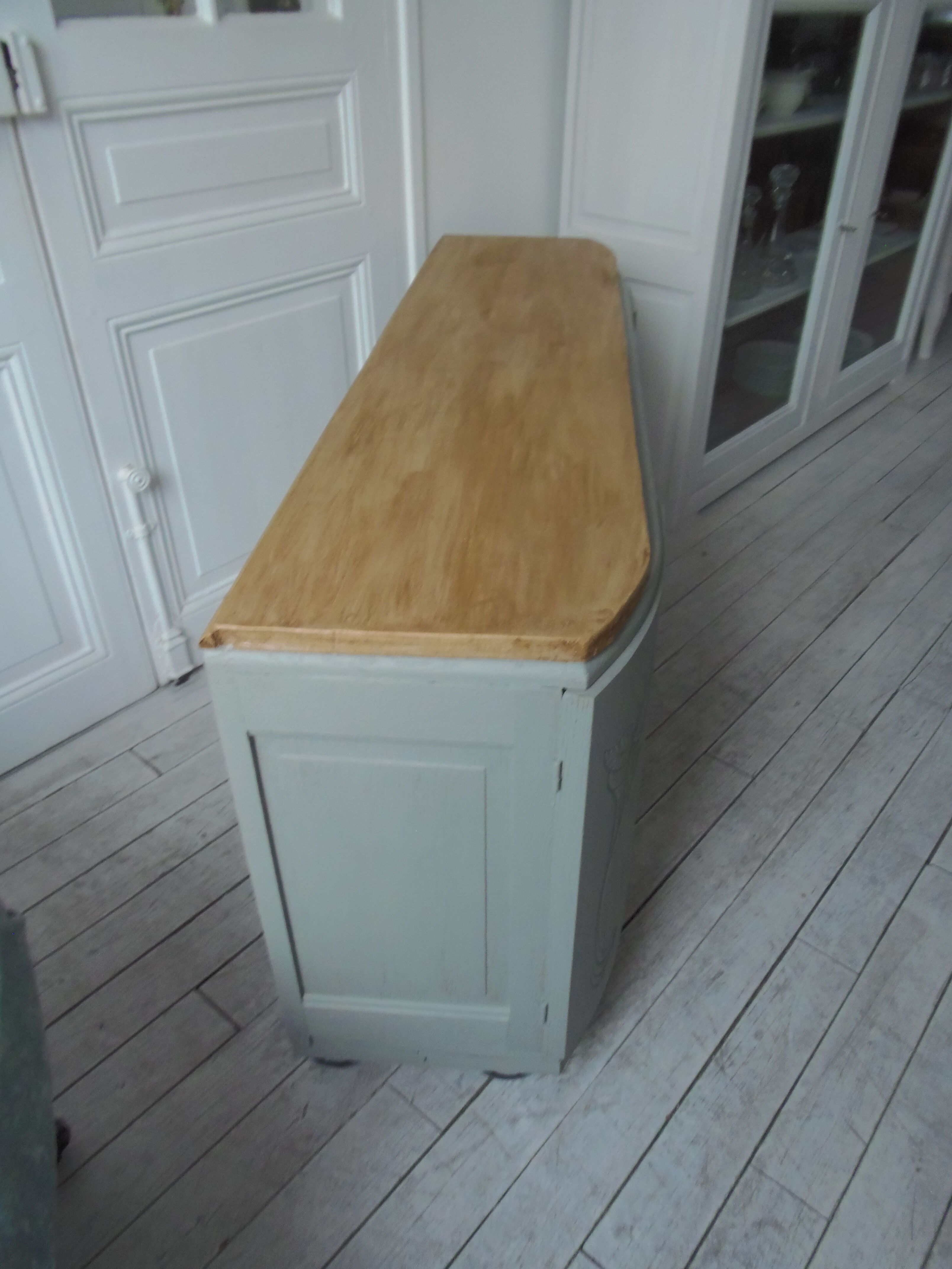 Art Deco furniture revisited in gray green and placed on wheels.