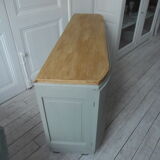 Art Deco furniture revisited in gray green and placed on wheels.