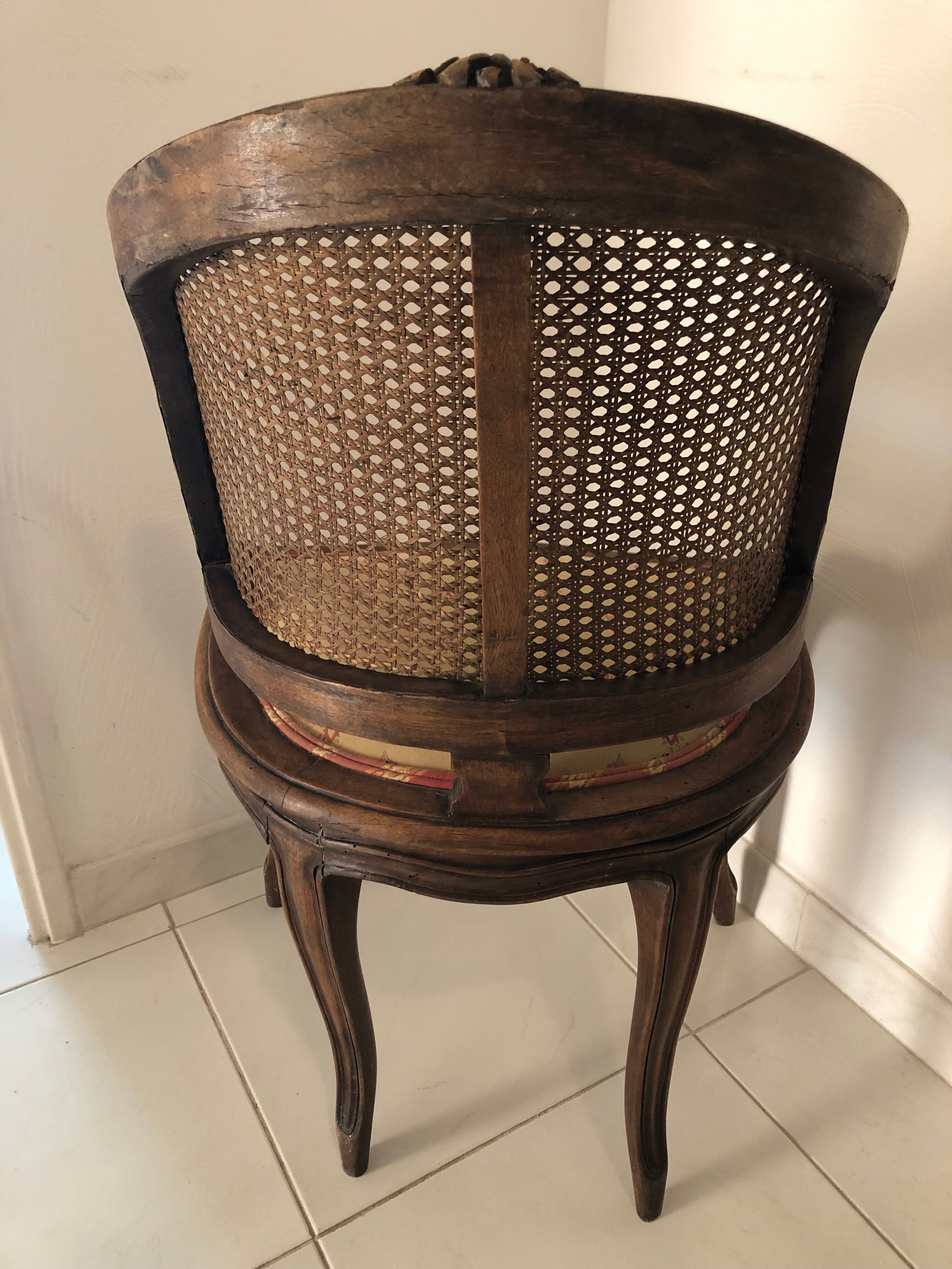 Old wooden armchair and cannage